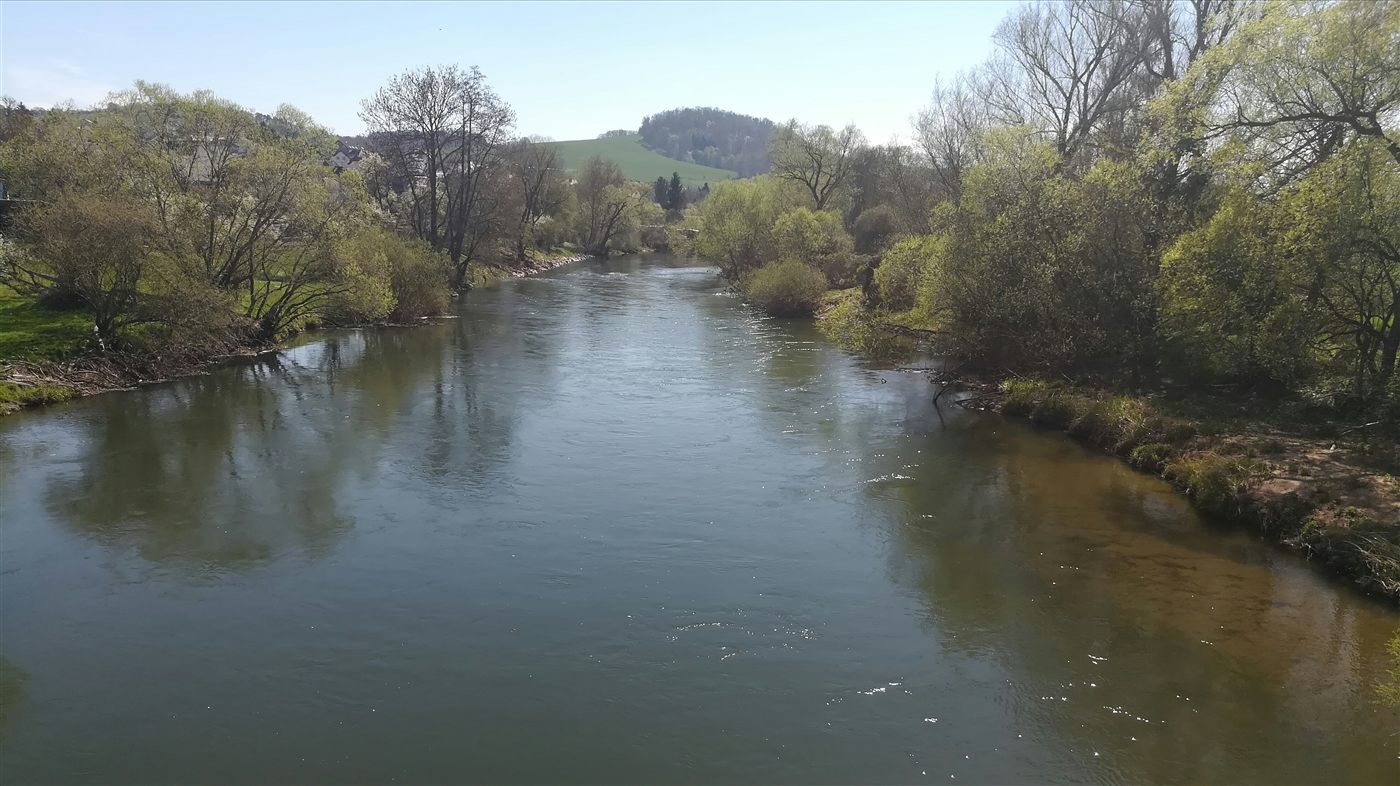 The Seine at dusk, the water low and slow between old stone banks.